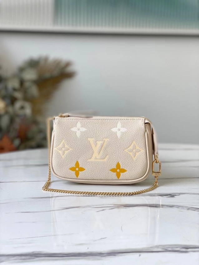 Louis Vuitton Mini Pochette Accessoires Monogram Empreinte Leather in Beige - M80501BE