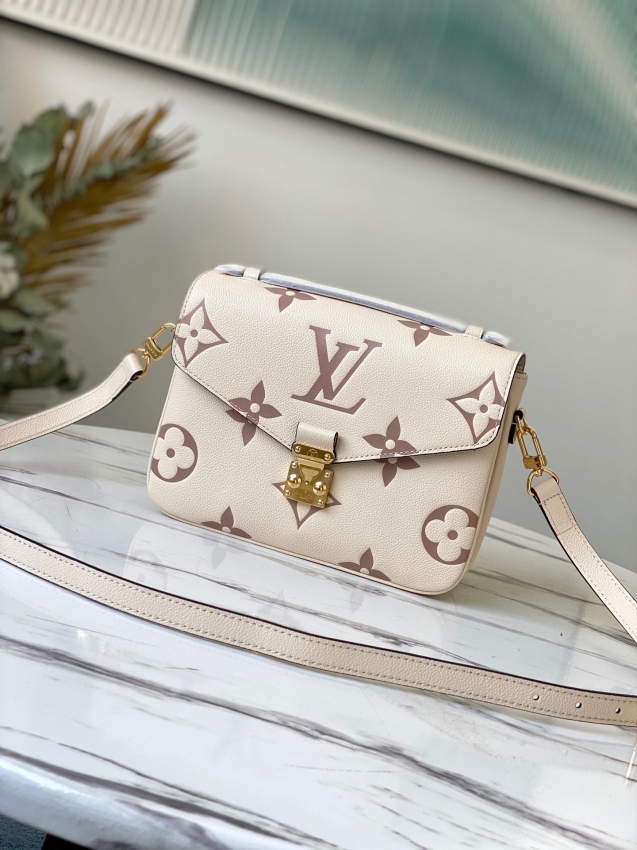 Louis Vuitton Pochette Metis Bicolor Monogram Empreinte Leather in Grey - Handbags M45596