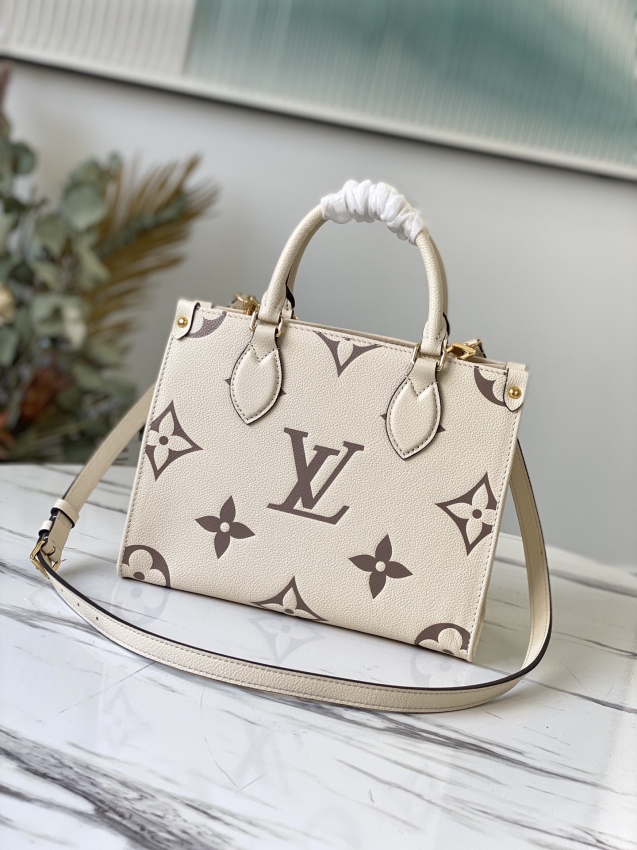 Louis Vuitton Onthego PM Bicolor Monogram Empreinte Leather in Beige - Handbags M45654