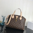 Louis Vuitton Monogram Canvas Rivoli MM handbag VVN M44546